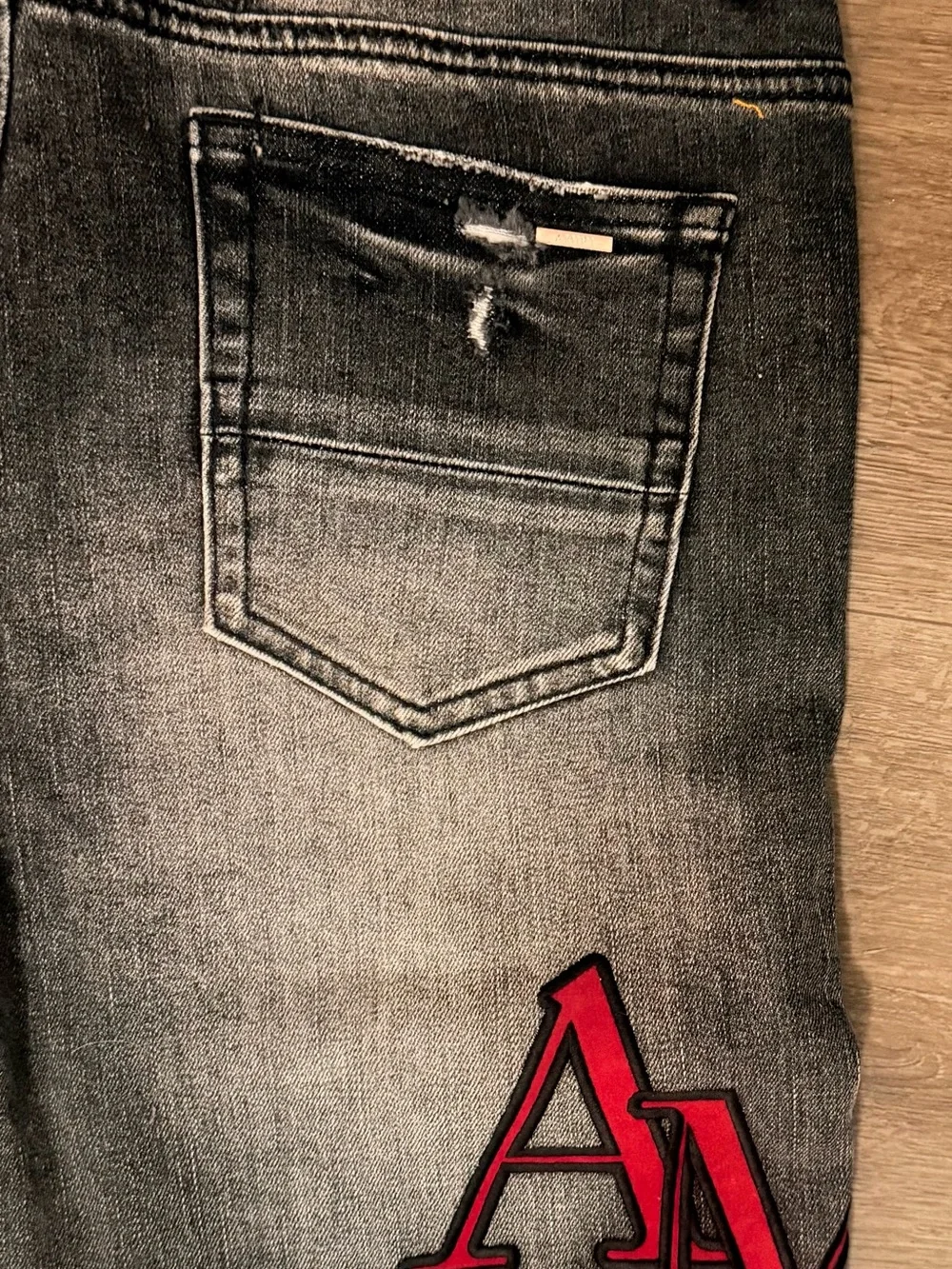 AMIRI Black Slim Ripped Jeans with Red Logo Patch